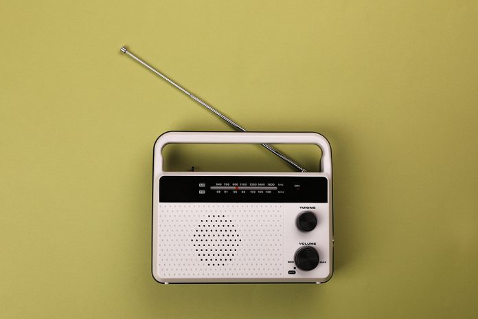 Retro Radio Receiver On Light Green Background, Top View