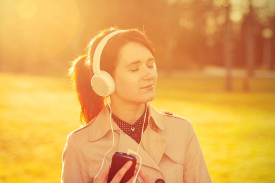bigstock-Woman-listening-to-music-in-he-91073852-e1756391071730