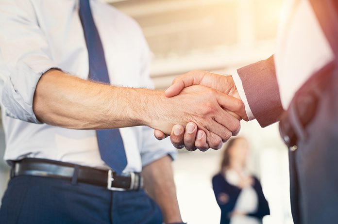 Businessmen shaking hands during a meeting. Closeup of business
