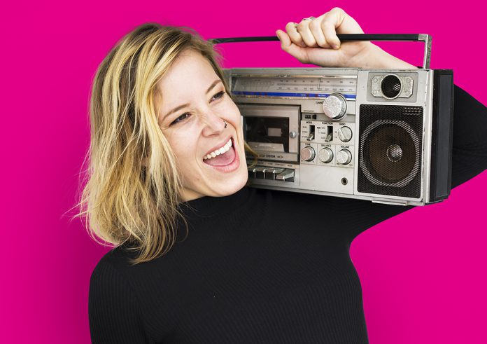 Female Holding Boombox Listen Music Concept