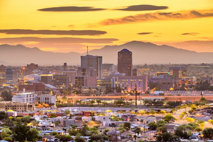 Tucson, Arizona, USA downtown city skyline with mountains at twi