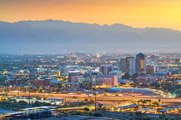 Tucson, Arizona, USA downtown city skyline with mountains at twi