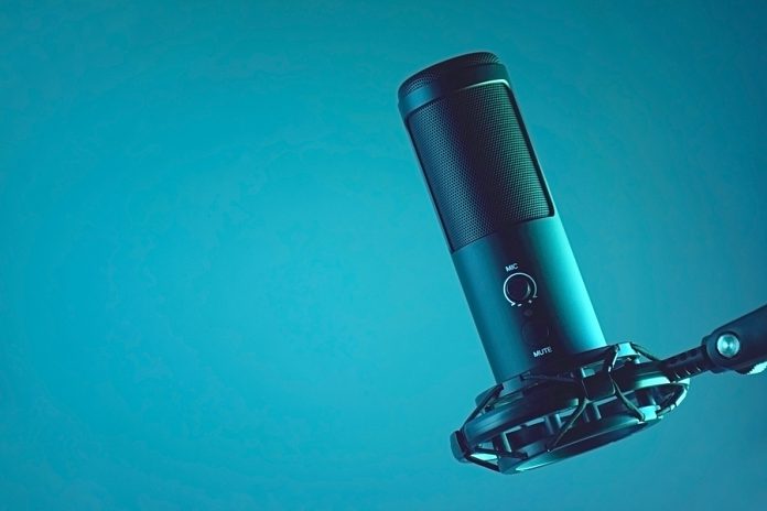 Studio Condenser Microphone Isolated On Dark Background. The Con