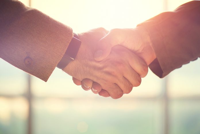 Business handshake. Business handshake and business people conce