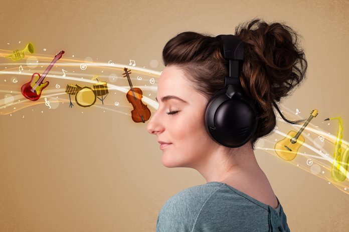 Pretty young woman listening to music, instruments concept