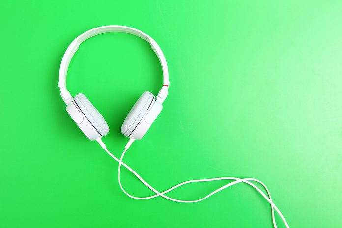 Headphone on green background