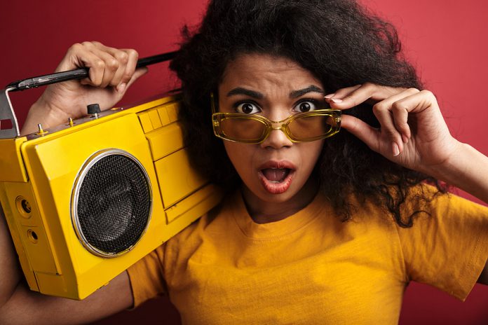 Image of surprised brunette african american woman with curly ha