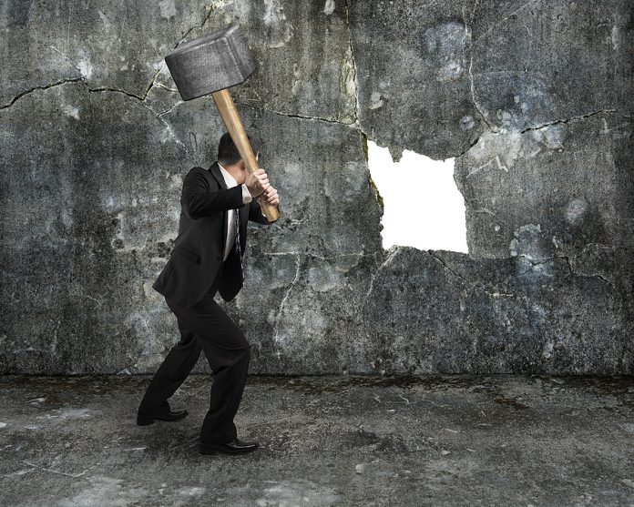 Businessman Hold Sledgehammer Cracking Big White Hole On Concret
