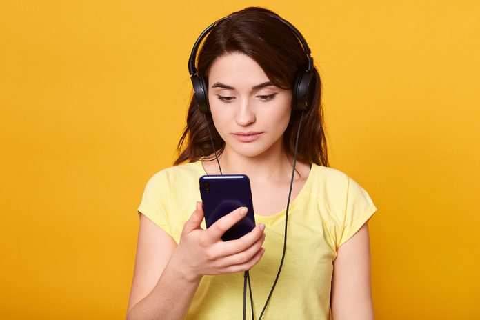 Closeup Portrait Of Dark Haired Female Wearing Yellow Casual T S