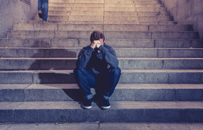 Depressed Sad Young Man Crying Sitting On Stairs Feeling Miserab