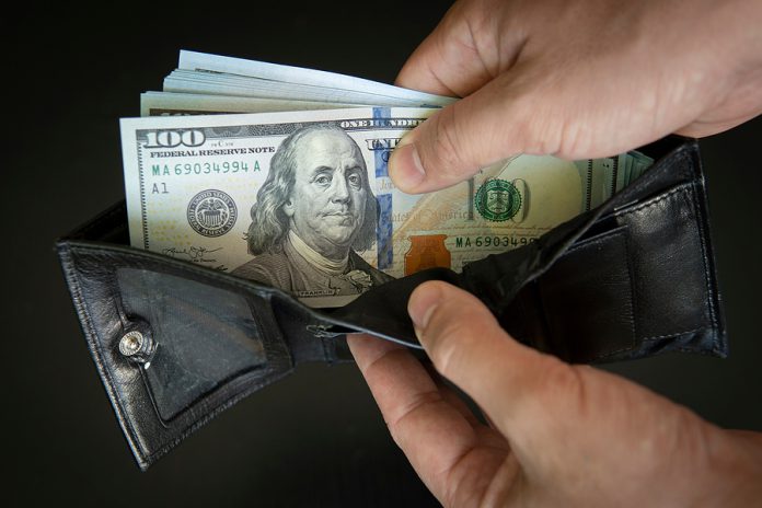 Hands Take Out American Dollars From Wallet. Closeup On A Mans H