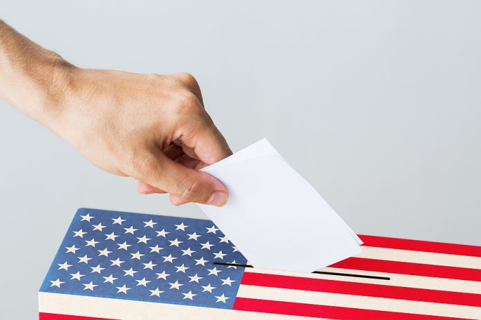 voting, civil rights and people concept - male hand putting his